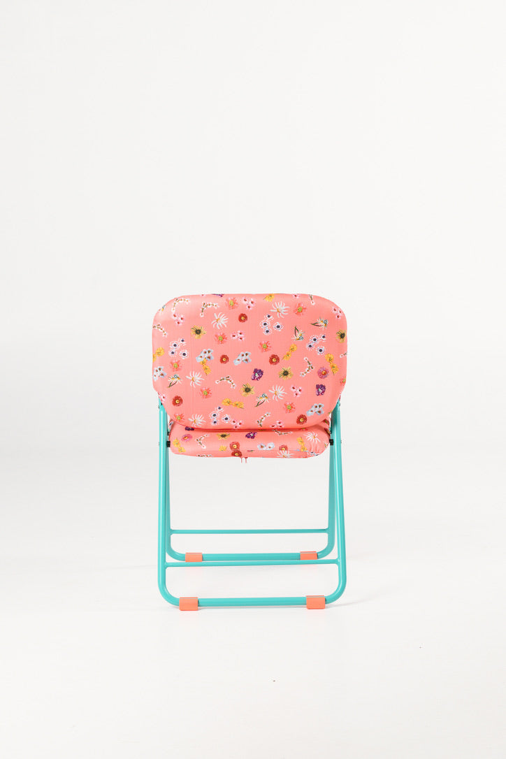 Small folding chair with a floral seat with a green frame