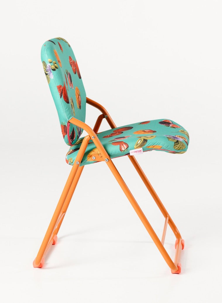 Foldable chair with colorful seat and backrest on a white background