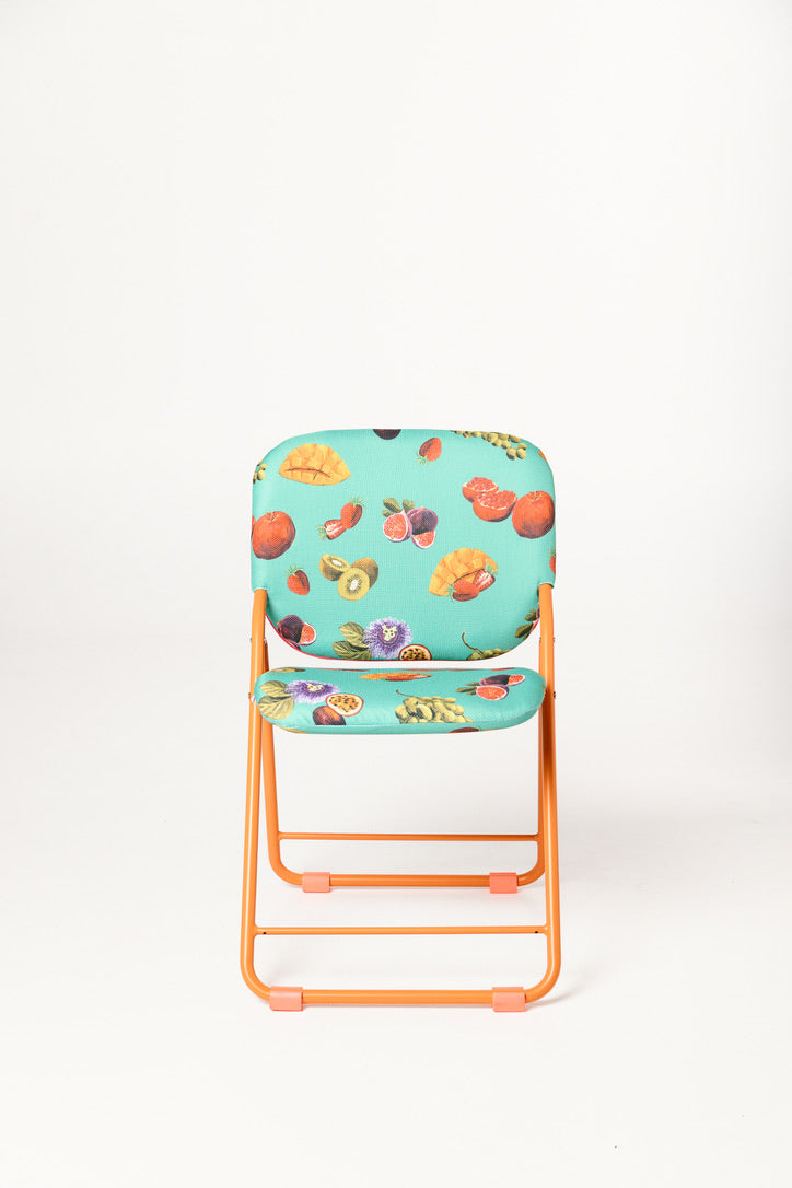 Floral-patterned chair with orange frame on a white background